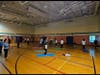 Volunteers and community families practice Surya Namaskar at the Ellicott city inaugural session.
