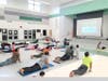 Participants perform Surya Namaskar during the inaugural Surya Namaskar Yajna session in Frederick.