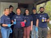 Volunteers painted and cleaned up the cabins and grounds of Camp Kettleford.