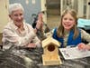 A Daisy Girl Scout and a resident of The Residence at Salem Woods connected over the building of bird houses. The troop regularly visits the residents at Salem Woods, creating bonds and providing both generations with a chance to learn from each other. 