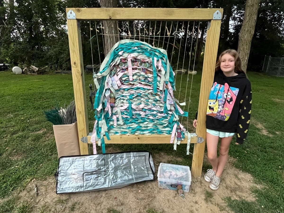 Silver Award Girl Scout Megan Getschmann created a woven artwork for the NH SPCA in Stratham.