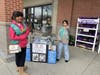 Girl Scouts Maya and Parisa stationed themselves at Market Basket to inform the public about the needs of shelter animals and ways to help. 