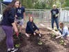 The ​Neighbors Helping Neighbors club  planting at the Paramus Food Bank  