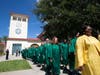 Some of the Gold Line of current students and the Green Line of Saint Leo University alumni process to the inauguration ceremony.