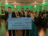 Saint Leo University Board of Trustees Chair D. Dewey Mitchell with Saint Leo University President Jeffrey D. Senese and his wife, Alicia, announced the Seneses’ donation for scholarships.