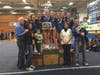 The Olmsted family joins the Carl Sandburg High School gymnastics team at the 2016 memorial meet.