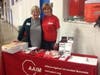 Representing the Alliance Against Intoxicated Motorists at the Erin E. Olmsted Memorial Gymnastics meet are (left) Pam Barnett and Rita Kreslin.