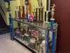 A few of the trophies won by YW Ballers