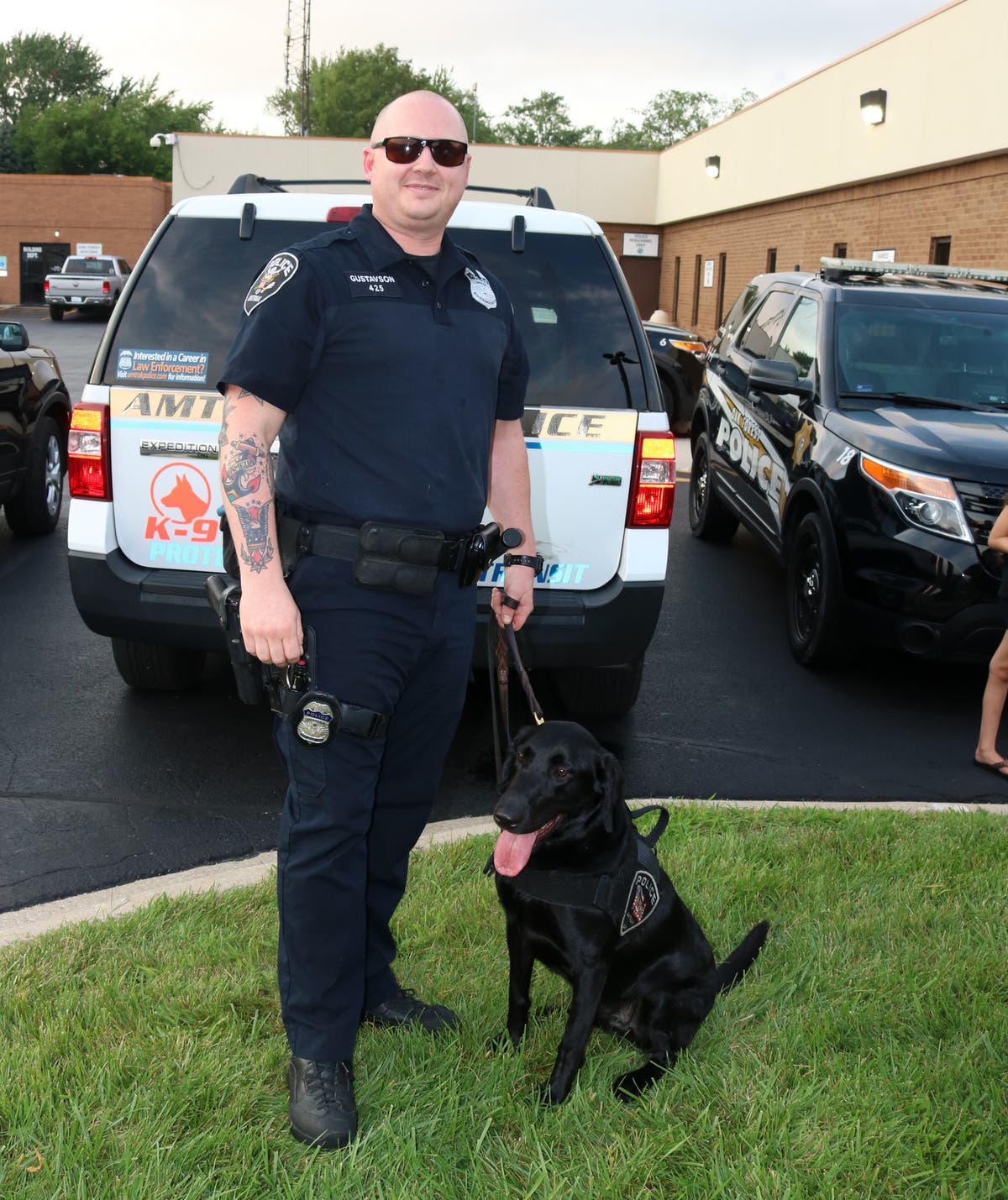 Officer Gerald Gustavson and his partner, Canine Officer Tim Cook, who are on the explosive detection team for the Amtrak Police. 