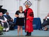 First-Generation valedictorian Alexis D’Ambly of Hackettstown is congratulated by Centenary University President John R. Schol, D.Min.