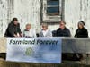 Karen Strano signs the paperwork to preserve her 80-acre farm for life. (L to R) Linda Balek, TLC; Karen Strano; Karen Lavin, TLC board member; Shawn Kingzette, TLC board member; Kim Elsenbroek, TLC.