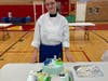 Amanda Hults shows off her first place Disney-themed Fondant Cake Decorating entry.