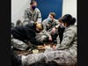 Cadets practice first aid techniques while getting their Red Cross certifications.