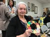 Sarah Neuman Resident Joan shows off her hand-made autumn wreath