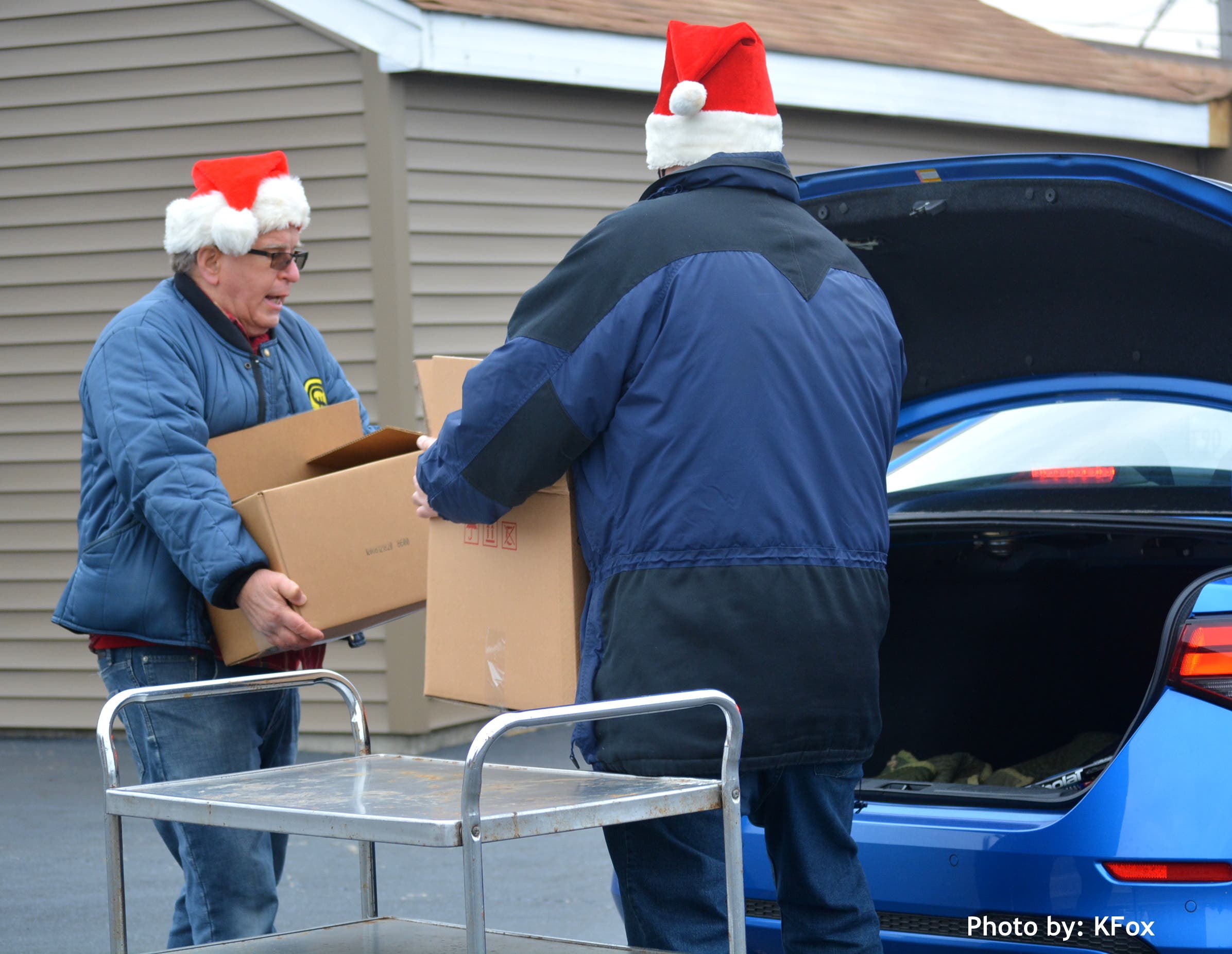 Santa's Ken and Ken Neth Loading Christmas Baskets into recipient's car