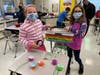 Palos West Elementary 4th grade students, (L-R) Kaylie Smit and Lucy Pater with their ‘Most Innovative Pet Toy’ winner the ‘Puppy Piñata.’
