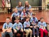 Members of the 1st/2nd and 3rd/4th grade teams and coaches from Palos 118 celebrate their win at the South Cook Math Bowl.