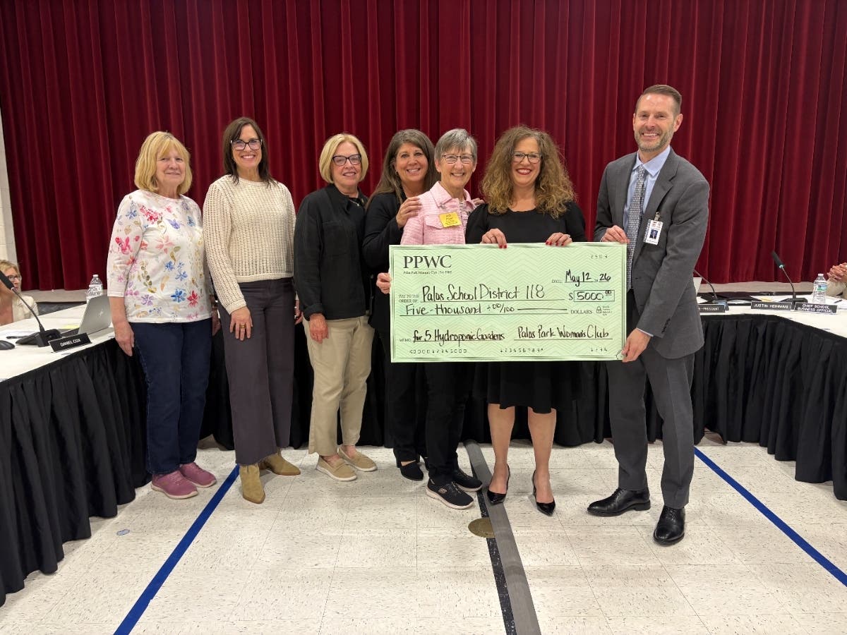 Representatives from The Palos Park Woman’s Club present a check for $5,000 to Palos School District 118 that will help establish an indoor garden program at the District 118 Central Office.