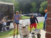 Stella Perdikis and Chris Norwell help move boxes at the library