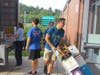 Jason Sherry, Eric Wojtowicz, and Ethan Boyd unload one of the trucks at the high school