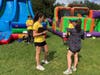 Jess Serra and Mia Rakowski discuss logistics for the day at Septemberfest