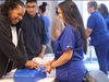 Wendy Corona, Medical Assisting graduate and current Patient Information Management student, watches Robin Overton Ellis