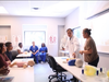 Dr. Zhou explains the importance of CPR to the group of 15 participants, including Woodside resident, Maria Medina.