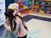 Elsa leads families on tour of YES Prep's new elementary classroom