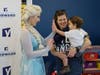 Elsa leads families on tour of YES Prep's new elementary classroom
