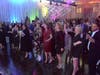 CIS of Houston supporters, including Elizabeth Russell and Lindsay Fox, listen to '80s tribute band The Spazmatics