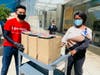 An ExxonMobil employee delivers meals to Texas Medical Center employees in partnership with Texas Restaurant Association and Revival Market
