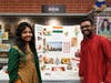 Srividya Suddala (left) and Ranjith Suddala present a display on India at the Around the World event.
