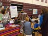 Students try weaving during the Around the World event.
