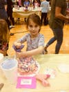 Kindergartener Cora Anello participates in the cake decorating contest April 11 at the Frankfort School District 157-C F