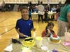 Students get creative with cake decorating at the event.