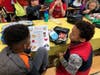 Students use conversation prompts during Mix It Up at Lunch Day to learn more about each other.