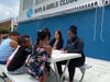 Susan Haspel, State Director for Boys & Girls Clubs in New Jersey (left) and Julienne Cherry, Executive Director of Summit Medical Group Foundation, chat with Club kids about sun safety at the Boys & Girls Clubs of Union County summer camp. 