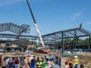 Community gathers for topping out ceremony in Bachman Lake.