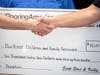 Check presentation from My Flooring America to Buckner Family Hope Centers.