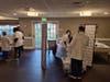 CVS staff setting up vaccination clinic inside Parkway Place.