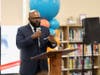 Award-winning journalist John Fountain led the Real Men Read program during Friday's ceremony and unveiling of the newly-renovated, expanded library. 