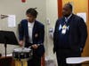 Southland College Prep senior Markell Fields shows his percussion skills to the band director of Langston University.
