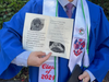A Wootton H.S. senior holds the flier that provides quotes from Jean-Pierre upholding the Genocide in Gaza. The keynote speaker failed to show up to deliver her address. 