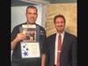 Steve Benyo, Owner of Fat Fish Taco, being awarded "Most Patriotic Business Display' certificate.