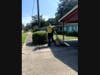 Elder Josh Isaksen pulling flooded carpet out of a home in Pensacola