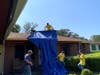 Rick Davis, Justin Meredith, Ben Isaksen, Allison Hadley, and Lillian Meredith tarping a roof at a home in Pensacola