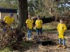 [l-r] Ben Isaksen, Allison Hadley, Lily Meredith, and Tommy Davis clearing debris from a yard in Pensacola