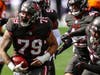 O'Connor is mobbed by teammates after blocking a punt and recovering the loose ball in the Bucs victory over Denver in Week 3.