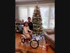 2018 winner Camila shows her brother Isaiah her new bike. Later that spring, Camila learned to ride without the training wheels.