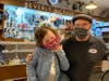 Beverly Bike & Ski owner Paul Weise helps Charlotte Moran pick out her new bike. Weiss and his wife Kathleen picked up the costs of the bikes this year.